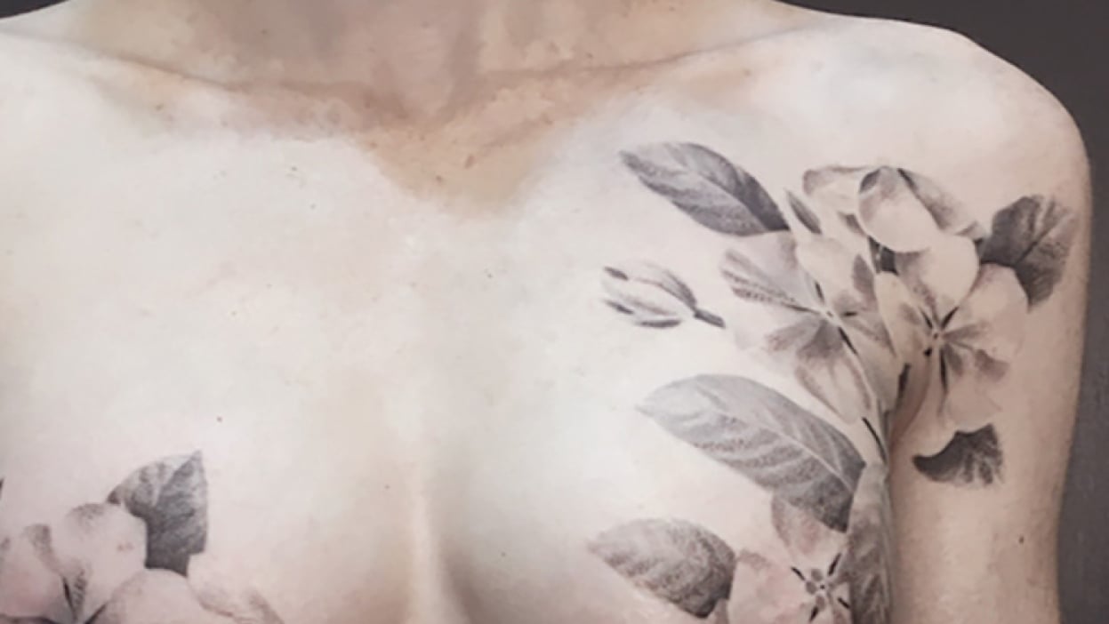 floral chest tattoo breast cancer survivor
