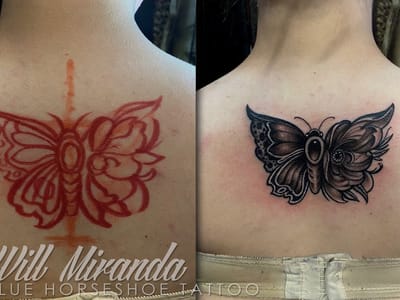 Blue Horseshoe Tattoo and Piercing