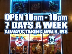 Blue Horseshoe Tattoo and Piercing