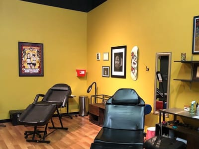 Cupid Slave Tattoo Company