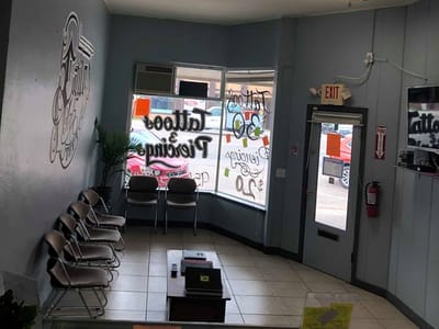 Estilo Ink Tattoo Parlor