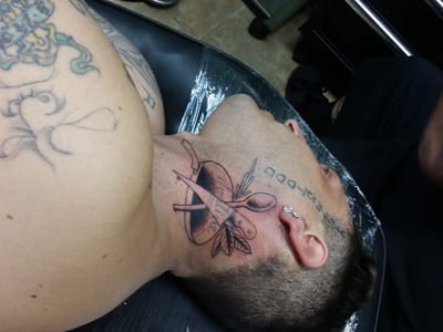 Flying Daggers Tattoo Parlor