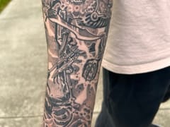 Heart Under Blade Tattoo