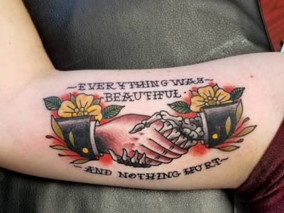 Heart Under Blade Tattoo