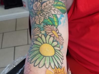 Iron & Ink Custom Tattoo And piercing.