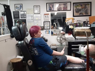 Malcolm's Tattoos and Piercings