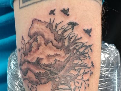 Malcolm's Tattoos and Piercings