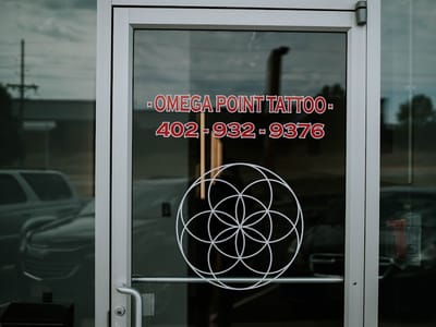 Omega Point Tattoo