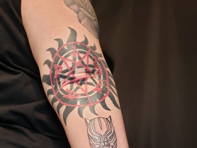 Omega Point Tattoo
