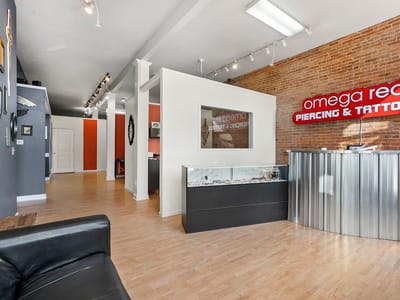 Omega Red Piercing & Tattoo