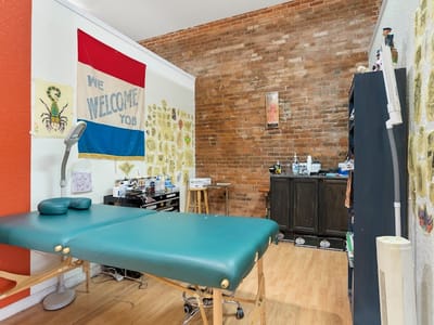 Omega Red Piercing & Tattoo