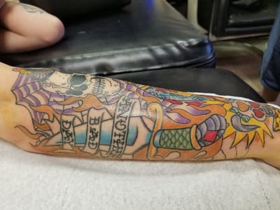 Painless Wayne's Tattoo and Body Piercing