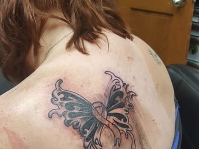 Purple Monkey Tattoo and Body Piercings