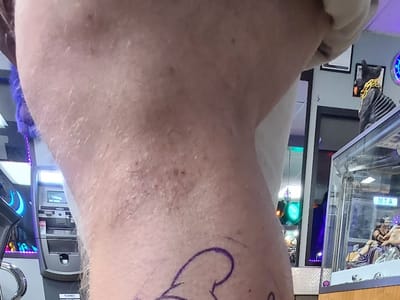 Purple Monkey Tattoo and Body Piercings