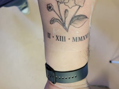 Purple orchid tattoo and piercing