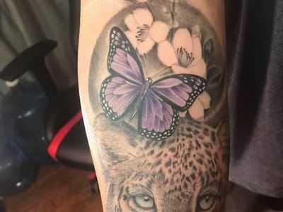 Purple orchid tattoo and piercing