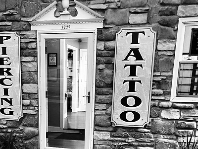 Queen of Hearts Tattoos & Body Piercing