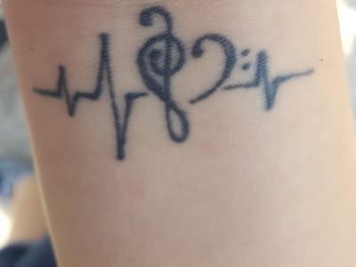 Queens Gold Tattoo Parlor