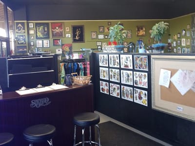 Sacred Owl Tattoo Studio