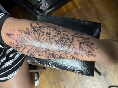 Sin on skin tattoo and piercing