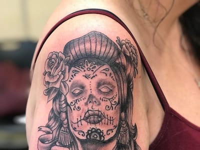 Sin on skin tattoo and piercing