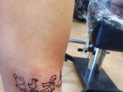 Square Rose Tattoo & Piercing