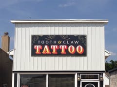 Tooth And Claw Tattoo