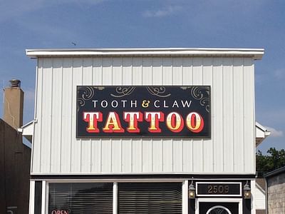 Tooth And Claw Tattoo