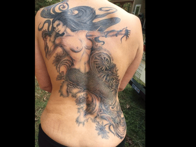 Utopian tattoo and body piercing