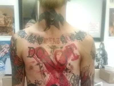 Wolfman Tattoos and Piercings